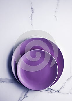 Purple empty plate on marble table background, tableware decor for breakfast, lunch and dinner for restaurant brand menu recipe,