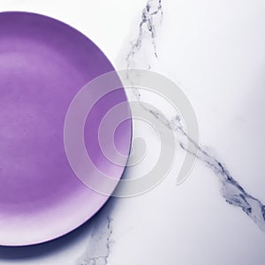 Purple empty plate on marble table background, tableware decor for breakfast, lunch and dinner for restaurant brand menu recipe,