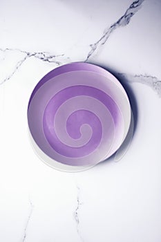 Purple empty plate on marble table background, tableware decor for breakfast, lunch and dinner for restaurant brand menu recipe,