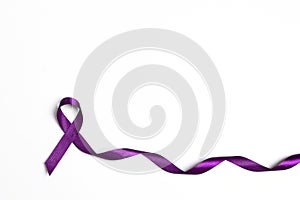 Purple epilepsy awareness ribbon on a white background with copy space