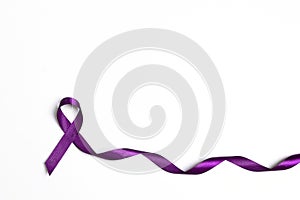 Purple epilepsy awareness ribbon on a white background with copy space photo