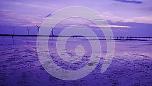 Purple feel to shoot the sillouette of Wind turbine array at Gaomei Wetland