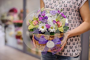 Purple flower bouquet composition in hands