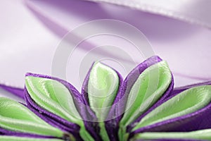 Purple flower broche that made of satin ribbon photo
