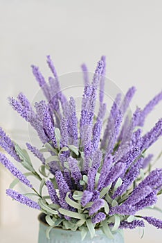 Purple flowers in a watering can