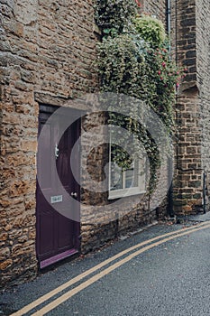 Purple front door of a traditional house in Frome, UK
