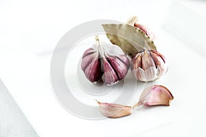 Purple garlic on white plate