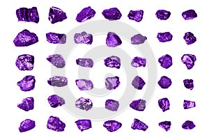 Purple gem stones white background isolated close up, raw gemstones, mineral samples, amethyst, sapphire, topaz, spinel, tanzanite