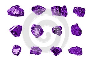 Purple gem stones white background isolated close up, raw gemstones, mineral samples, amethyst, sapphire, topaz, spinel, tanzanite