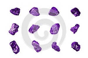 Purple gem stones white background isolated close up, raw gemstones, mineral samples, amethyst, sapphire, topaz, spinel, tanzanite