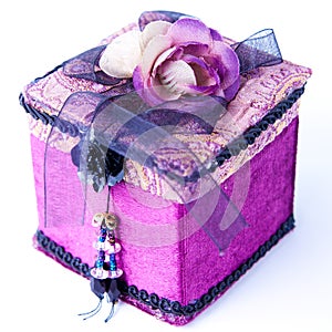 Purple gift box with a rose isolated.