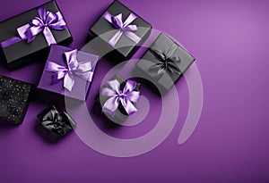 purple gift boxes with shiny black ribbons photo