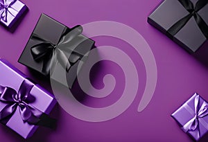 purple gift boxes with shiny black ribbons photo