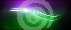 Purple and green wave on dark background creates visual effect lighting