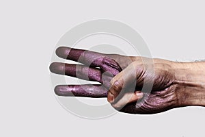 Purple Hand showing three Fingers