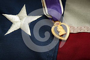 The Purple Heart medal and the American flag