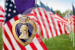 Purple Heart Miltary Merit Medal Against Memorial Field of American Flags