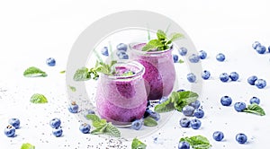 Purple homemade yogurt or smoothie with blueberries, chia seeds