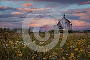 Purple house at Magdalen islands in canada during sunset