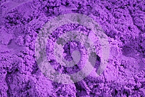 Purple kinetic sand. Background, texture