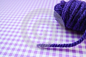 Purple knitting yarn background