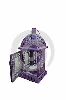 Purple lantern. Candlestick in the form of retro lamp. Purple candle holder/ lamp. An isolated object on white background.