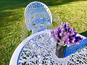 Purple lavender in a vase on table under the sunlight.