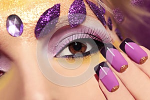 Purple makeup and nails.