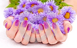 Purple manicure and flowers