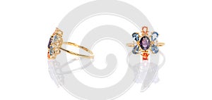 Purple, orange and blue sapphire Jewel or gems ring on white background with reflection. Collection of natural gemstones