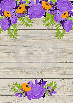 Purple and orange flowers on wooden background