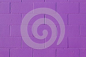 Purple painted cement block wall texture background