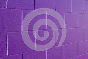 Purple painted cement block wall texture background