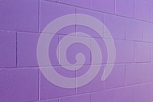 Purple painted cement block wall texture background