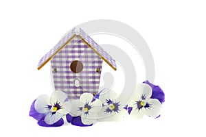 Purple pansies in a reed basket