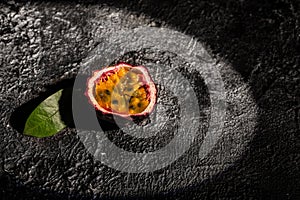 Purple passion fruit with cut in half on a dark background, Long banner format. top view