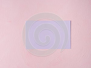 Purple pastel card on pink textured background