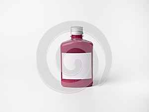 Purple pastel color drink in plastic bottle container with empty logo label. mixed many vegetables and fruits smoothie juice on st