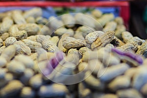 Purple peanut for sale at the fresh market. The peanut, also known as the groundnut and the goober.