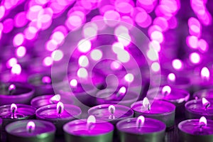 Purple pink candle light. Christmas or Diwali celebration tealight candlelight. Christmas vigil lights