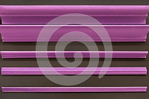 Purple pink ceiling skirting board material for repair and interior design of the corners of the ceiling of the house inside