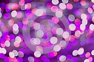 Purple and pink holiday bokeh abstract background