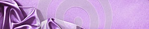 Purple pink silk satin background. Soft folds. Shiny fabric. Luxury lilac background with space. Web banner.  Website hea