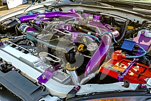 Purple pipes under the hood of modern car