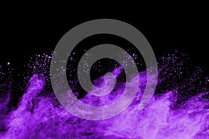 Purple powder explosion on black background.