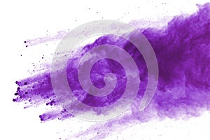 Purple powder explosion on white background. Colored cloud. Colorful dust explode. Paint Holi