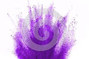 Purple powder explosion on white background. Violet cloud splatted. Color dust explode. Paint Holi.