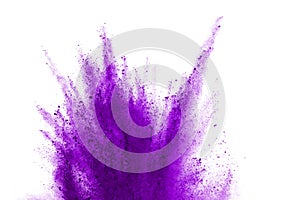 Purple powder explosion on white background. Violet cloud splatted. Color dust explode. Paint Holi.