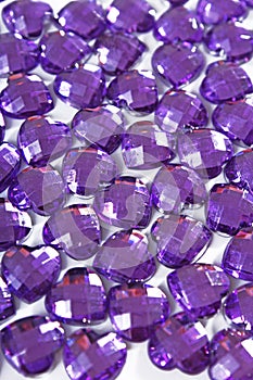 Purple Rhinestone background. Heart shape texture as backdrop isolated white studio photo. Bling rhinestone crystal