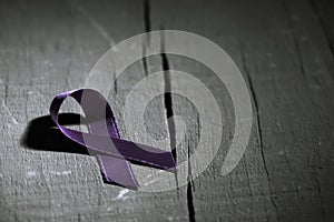 Purple ribbon against the violence against women